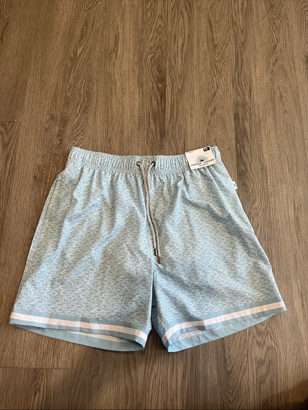Vintage Summer Men's Light Blue Athletic Swim Shorts with Subtle Wave Print!
